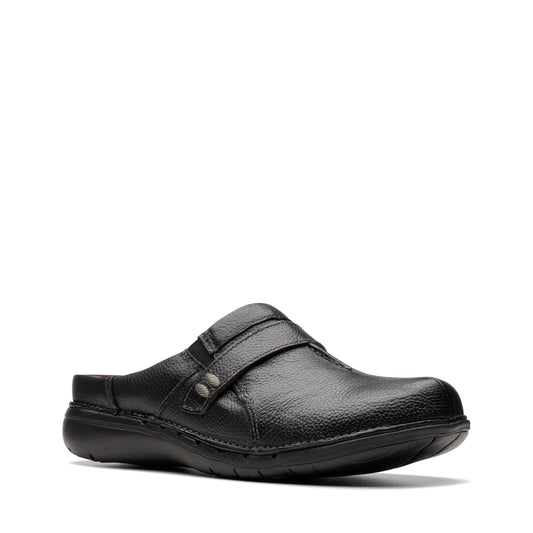 Black leather clog-style shoe with a thick sole and a decorative strap.