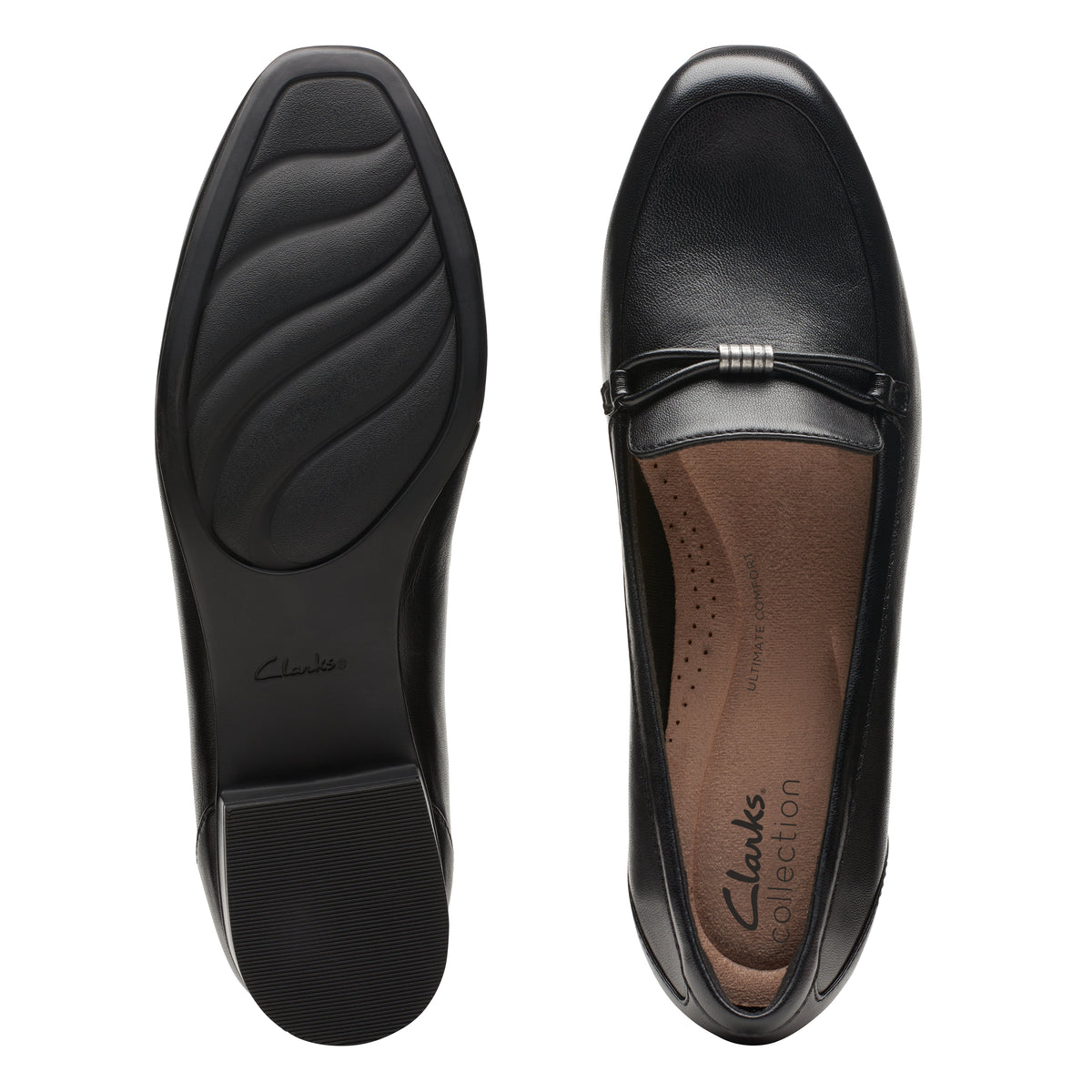 Black leather loafers with metal ornament detail, and collection text on sole.