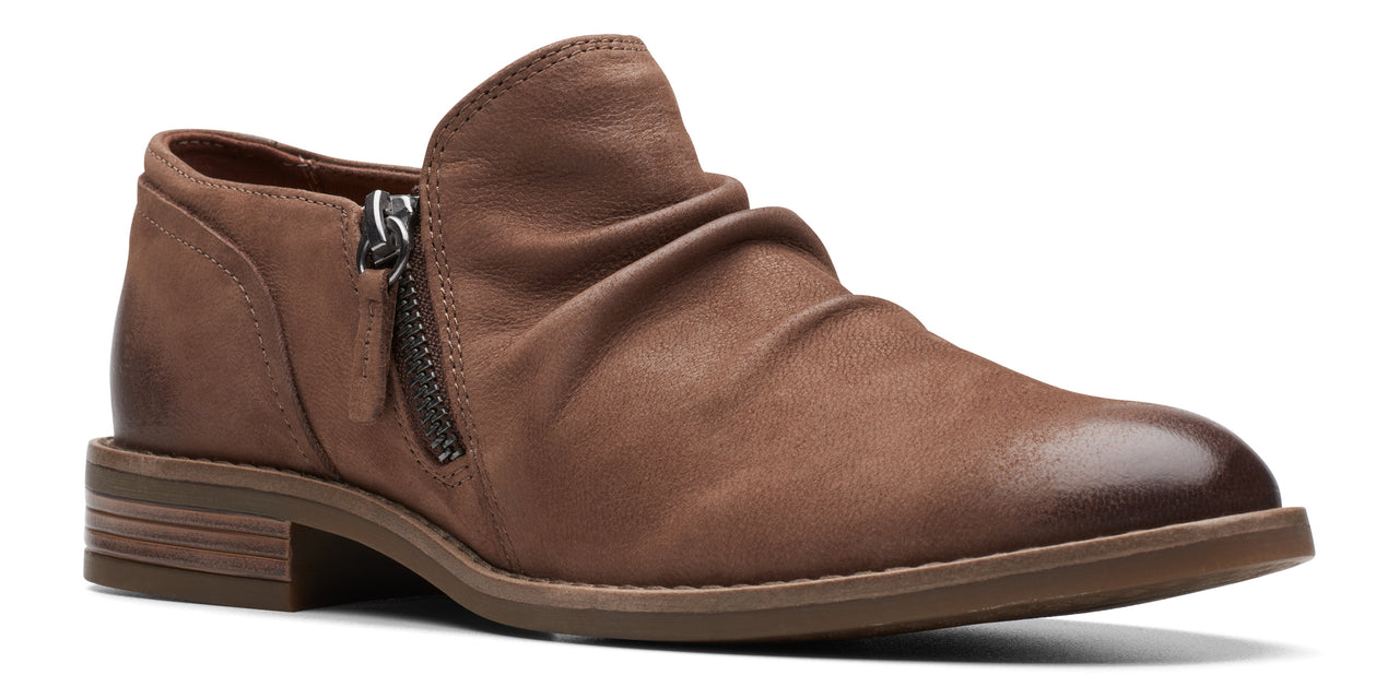 A brown ankle boot with a side zipper and a slight heel.