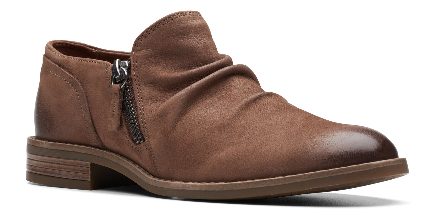 A brown ankle boot with a side zipper and a slight heel.