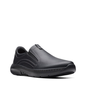 A black leather slip-on shoe with a rounded toe and a thick, textured sole.