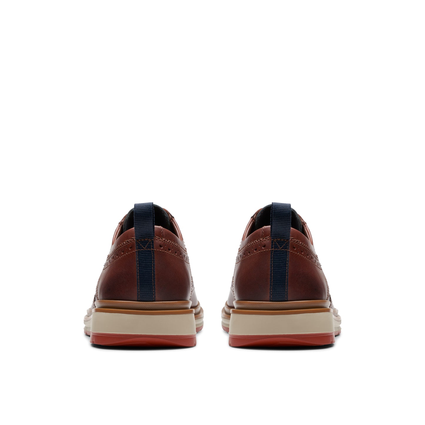 Pair of burgundy dress shoes, rear view, with blue pull tabs and a striped sole.