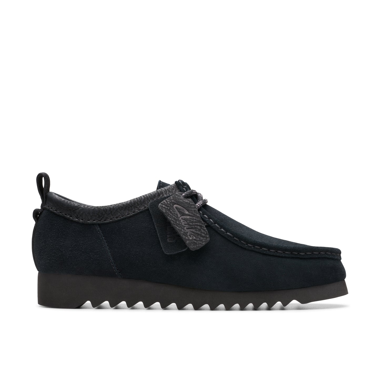 Black suede moccasin-style shoe with a serrated rubber sole.