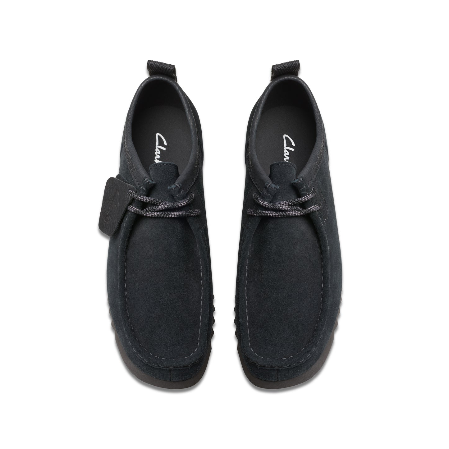 Top-down view of two black suede chukka-style shoes with matching laces and heel pull tabs.