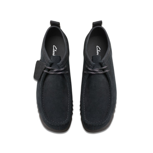 Top-down view of two black suede chukka-style shoes with matching laces and heel pull tabs.