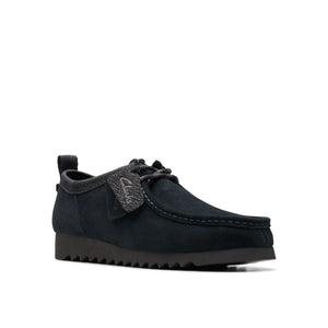 Low-profile, dark navy shoe with a grey collar and patterned laces.