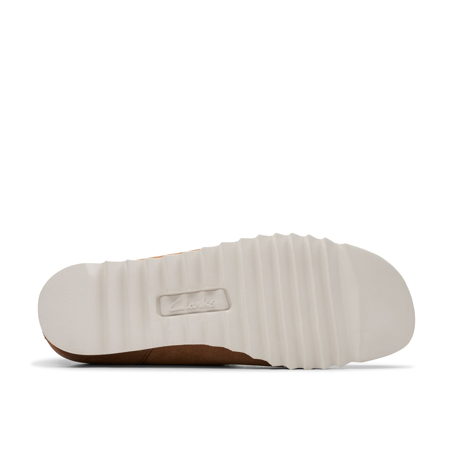 Bottom view of a light tan shoe showing a thick white ridged sole with the word "Clarks" embossed in the center.