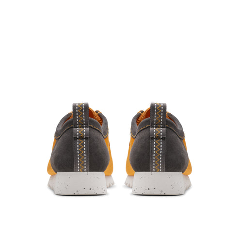 Back view of two orange and gray athletic shoes with white speckled soles.