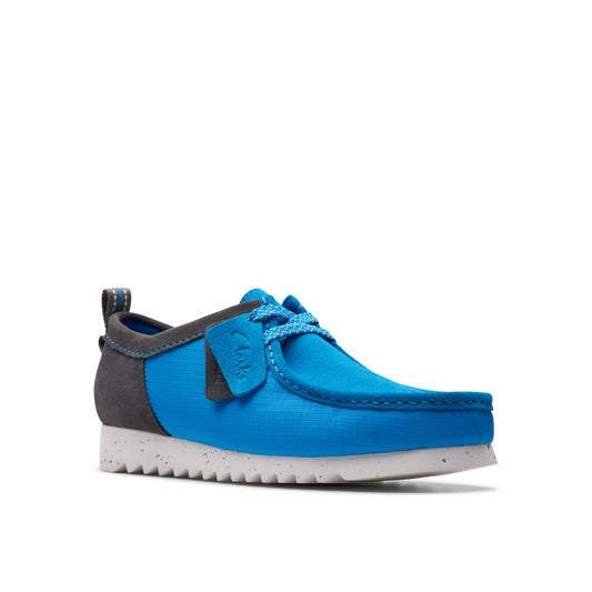 Blue and gray moccasin style shoe with speckled sole and laces.