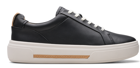 A black sneaker with white laces and a white sole.