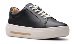 Black leather sneaker with white laces and platform sole featuring a tan accent.