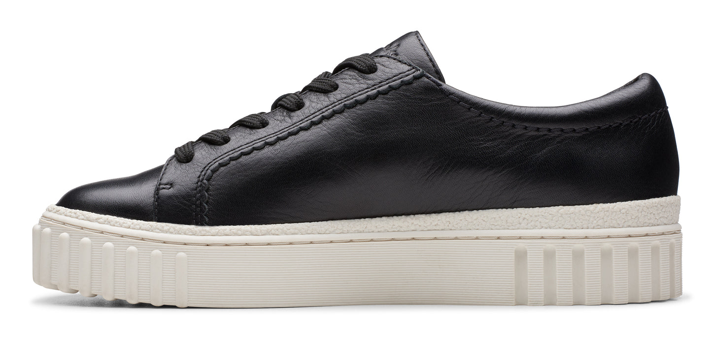 Black leather sneaker with a thick white sole.