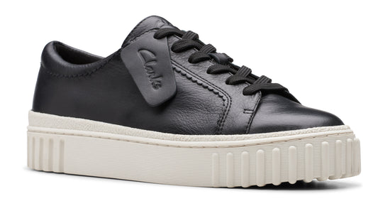 Black leather sneaker with thick white platform sole.