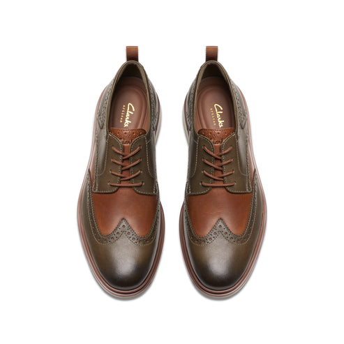 Overhead shot of brown leather brogue shoes.