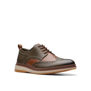 Olive and brown leather brogue dress shoe with a light tan sole and brown laces.