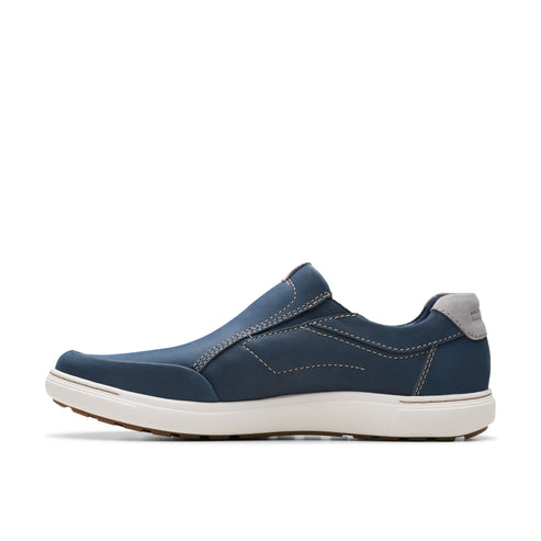 Blue slip-on shoe with white sole and gray heel pad.