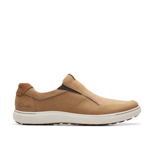 Tan leather slip-on shoe with a white sole.