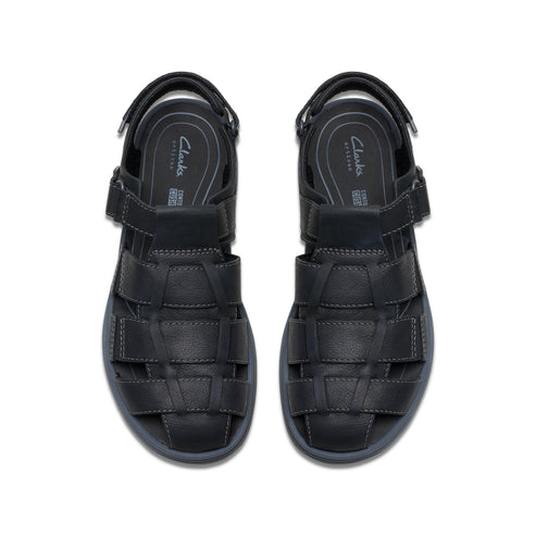 Pair of black, cage-style sandals with velcro straps and cushioned insole, top view.