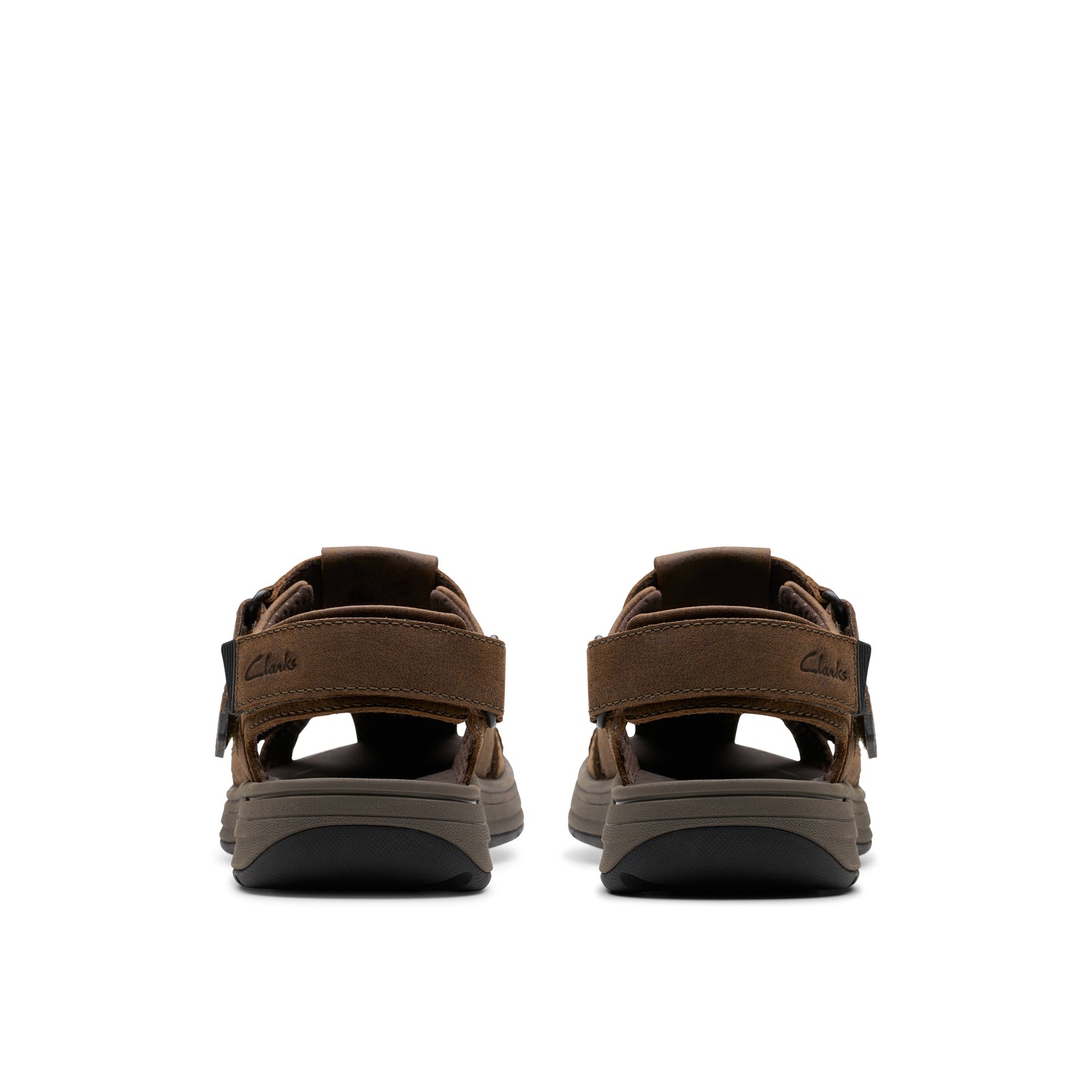 Pair of brown sandals viewed from the rear, showing straps and soles.