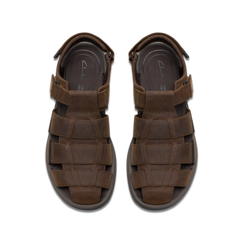 A pair of brown leather fisherman sandals, seen from above.