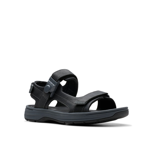 Black sandal with hook and loop straps.