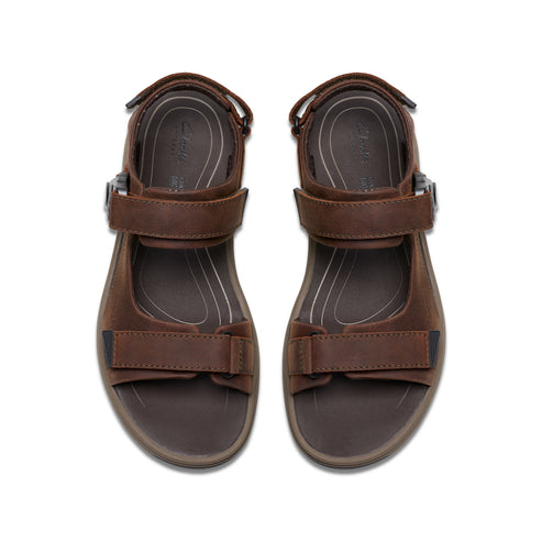 Pair of brown leather sandals with adjustable straps.