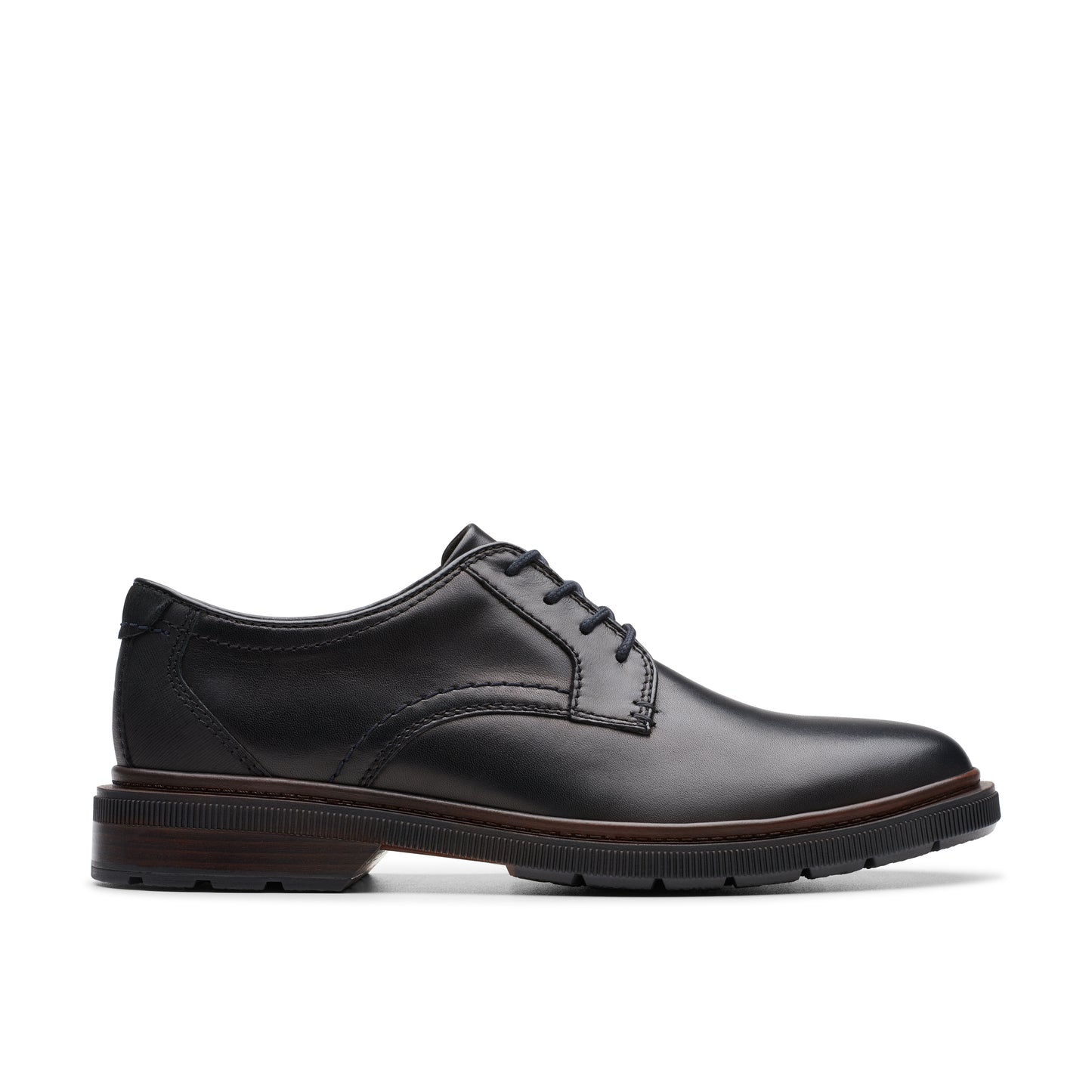 Black leather dress shoe with a lace-up closure and a flat, ridged sole.