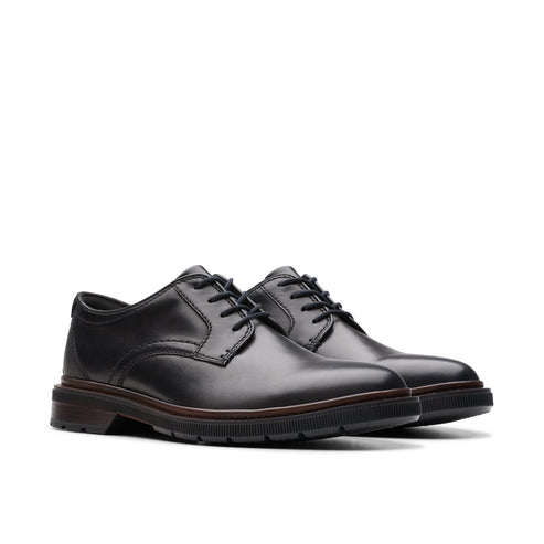 A pair of black leather dress shoes with lace-up closure.