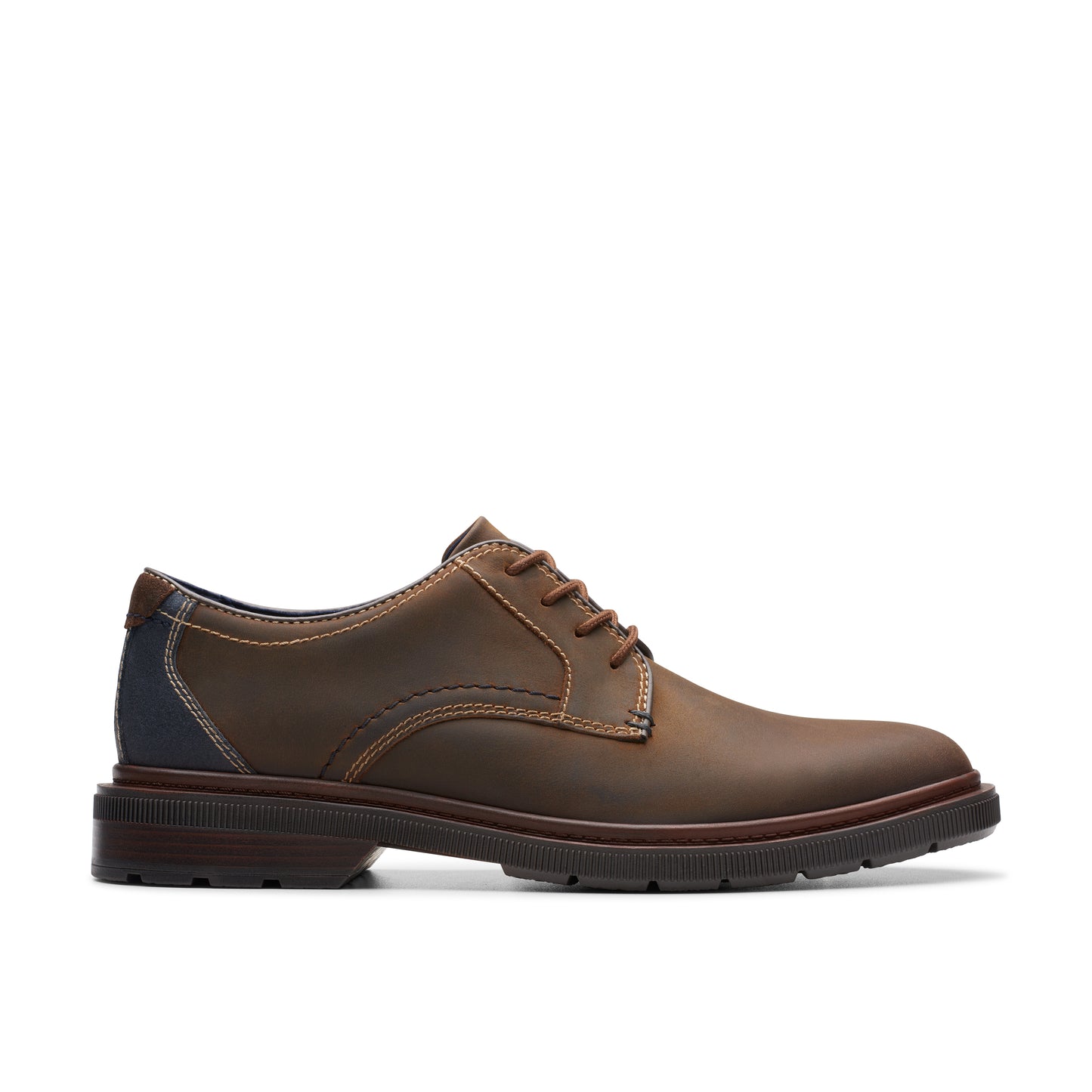 Brown leather dress shoe with lace-up closure and contrast stitching.