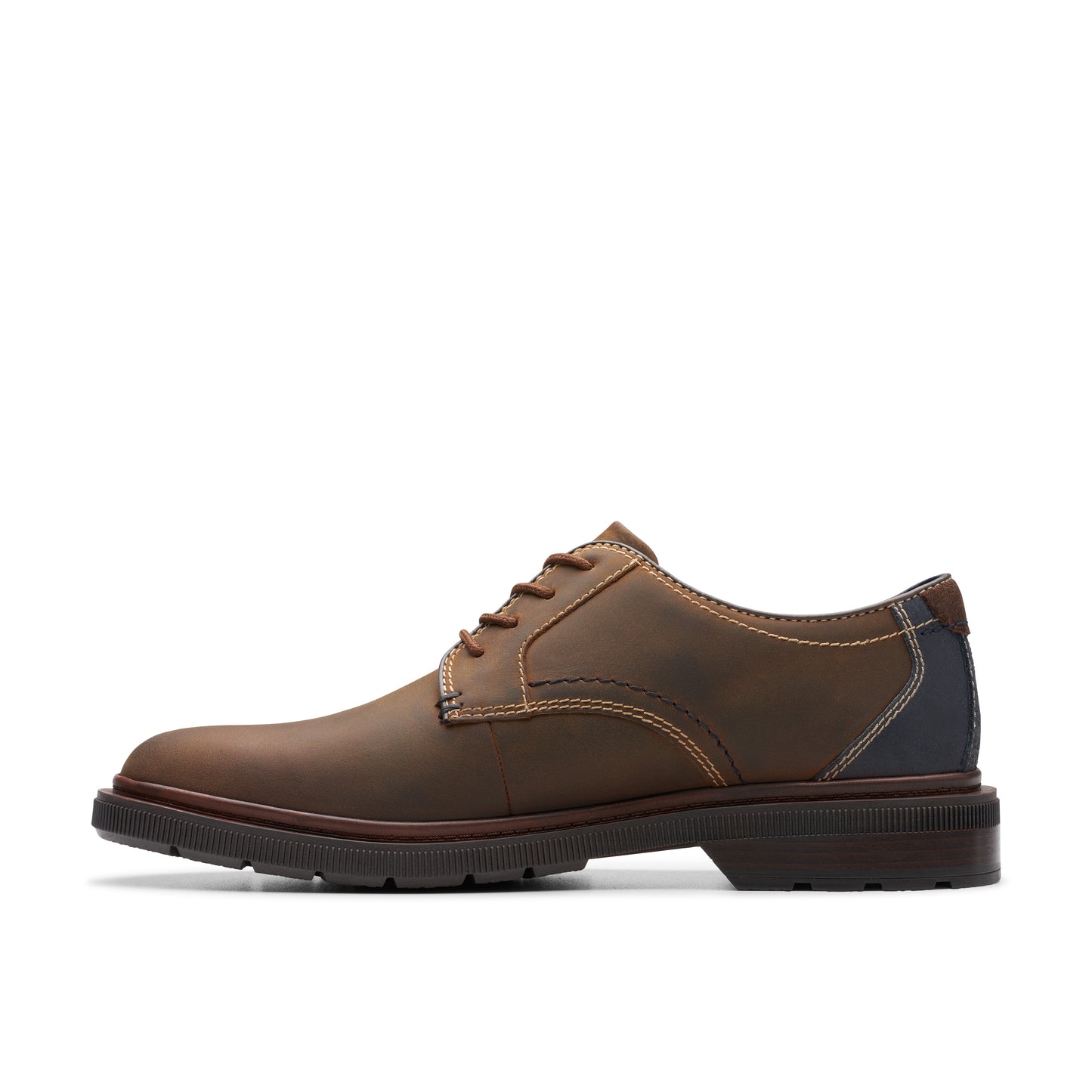 Brown leather dress shoe with contrast stitching.