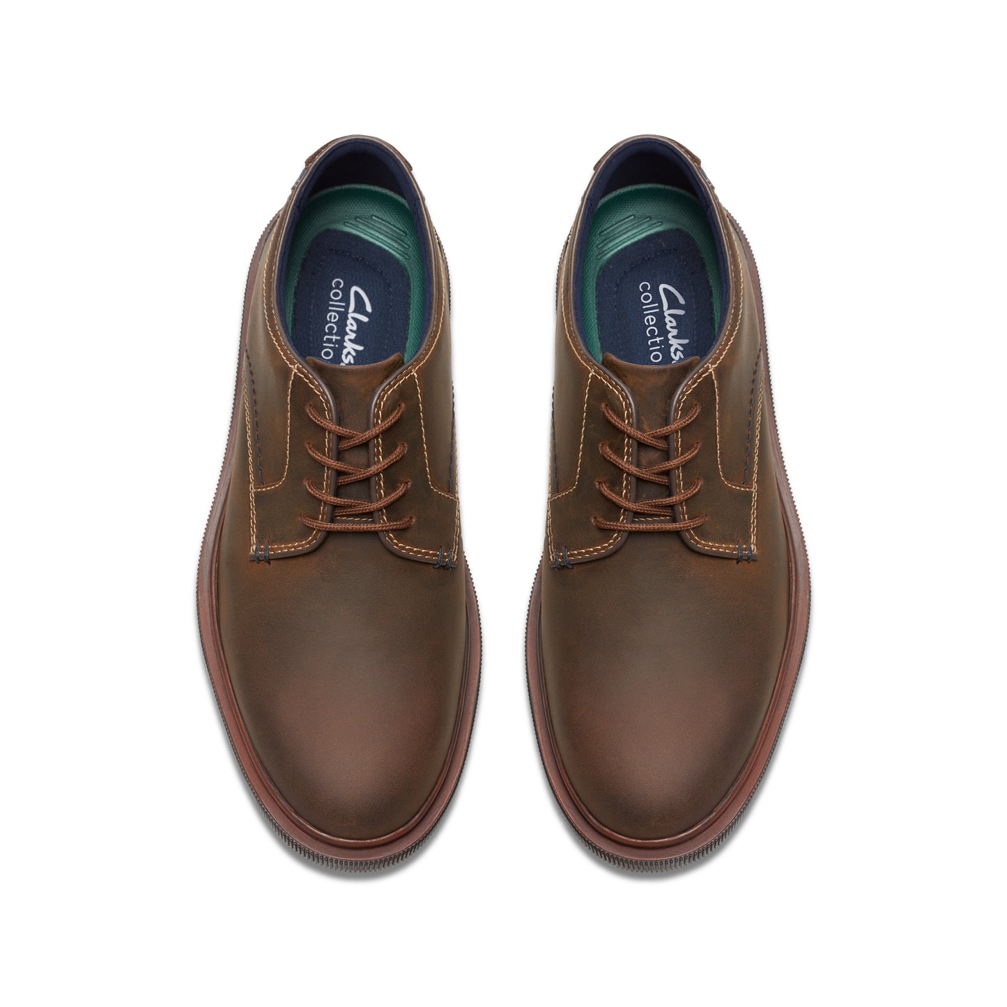 A pair of brown leather dress shoes with matching laces.