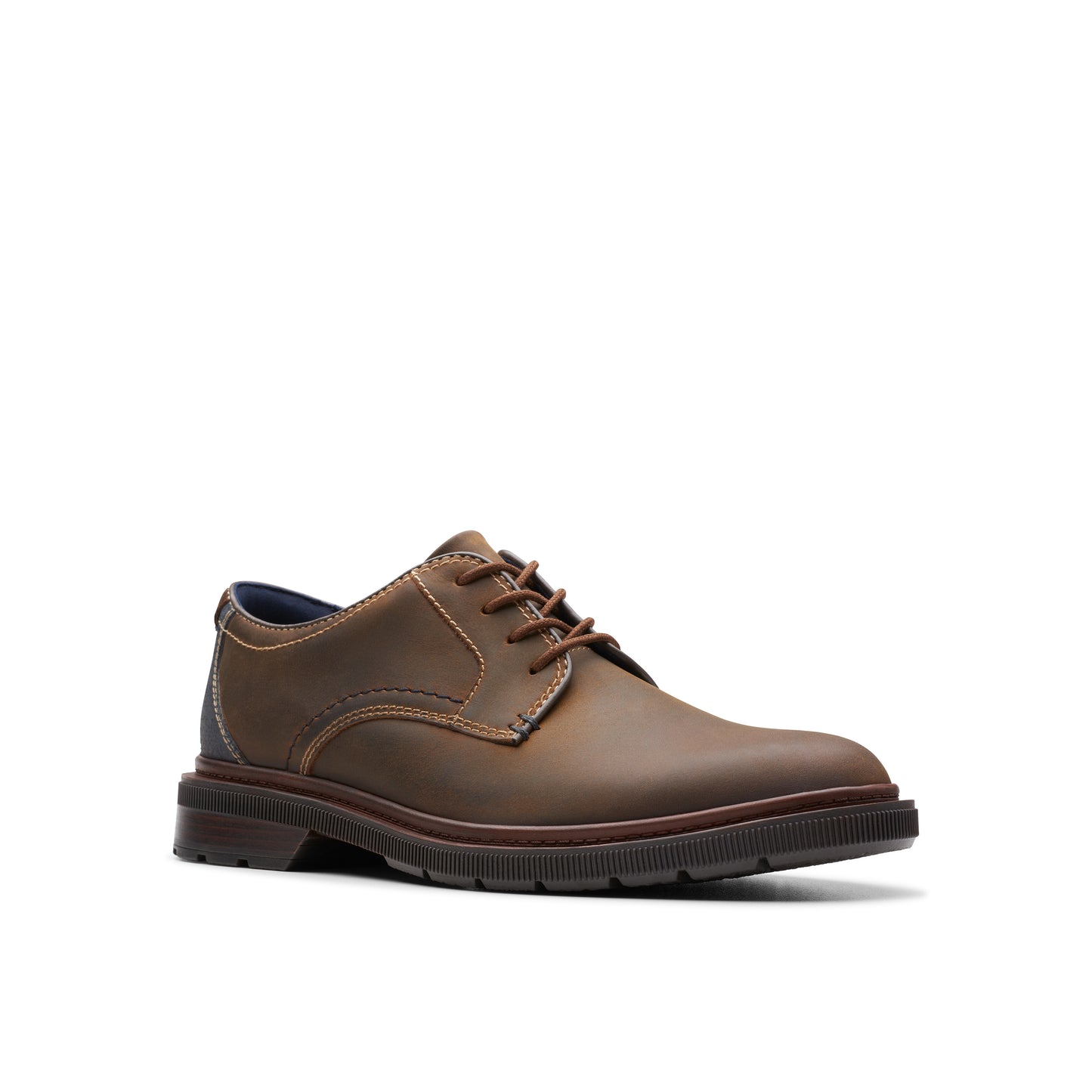Brown leather oxford shoe with round toe and lace-up closure.