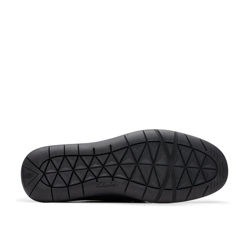 Black shoe sole with triangle pattern.