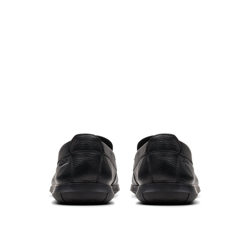 Rear view of two black leather loafers.