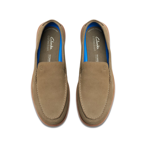 Pair of taupe-colored suede loafers with blue linings.