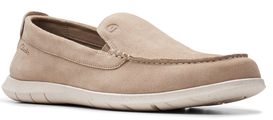 Tan slip-on shoe, eyelet detail.
