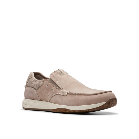 Beige slip-on shoe with a moccasin-style toe and visible stitching.