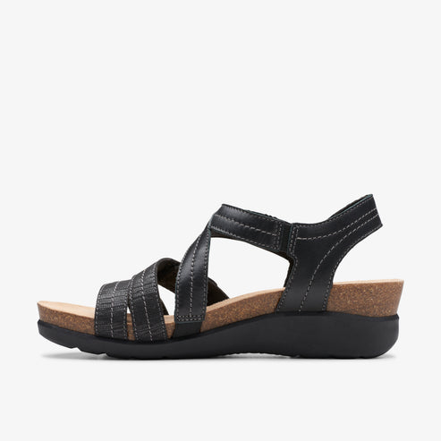 Black sandal with cork footbed and multiple straps.