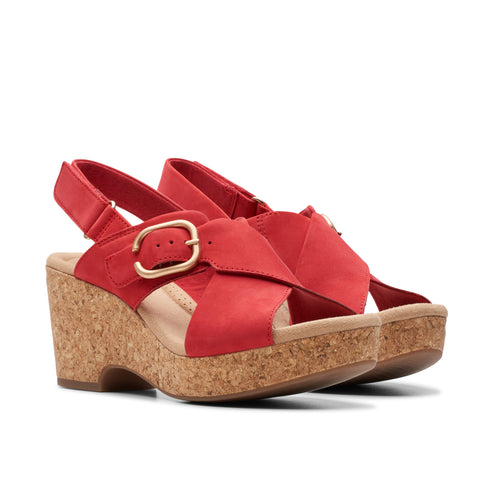 Red wedge sandal with cork platform and gold buckle.