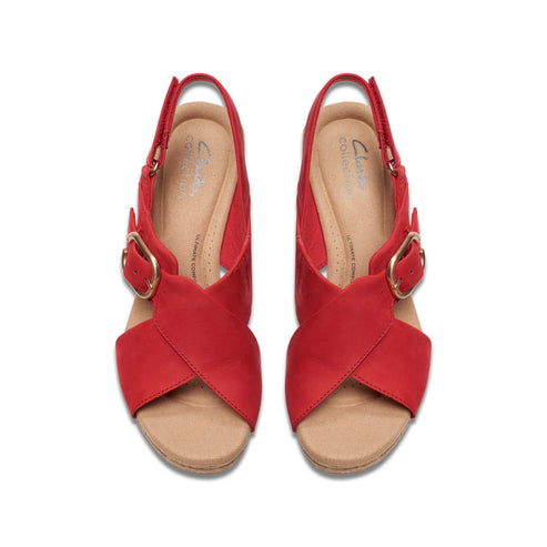 Overhead view of red leather open-toe slingback sandals with a gold buckle closure.