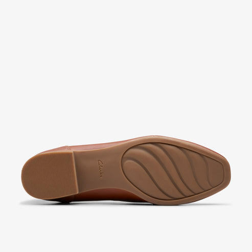 Brown shoe sole with wave pattern.