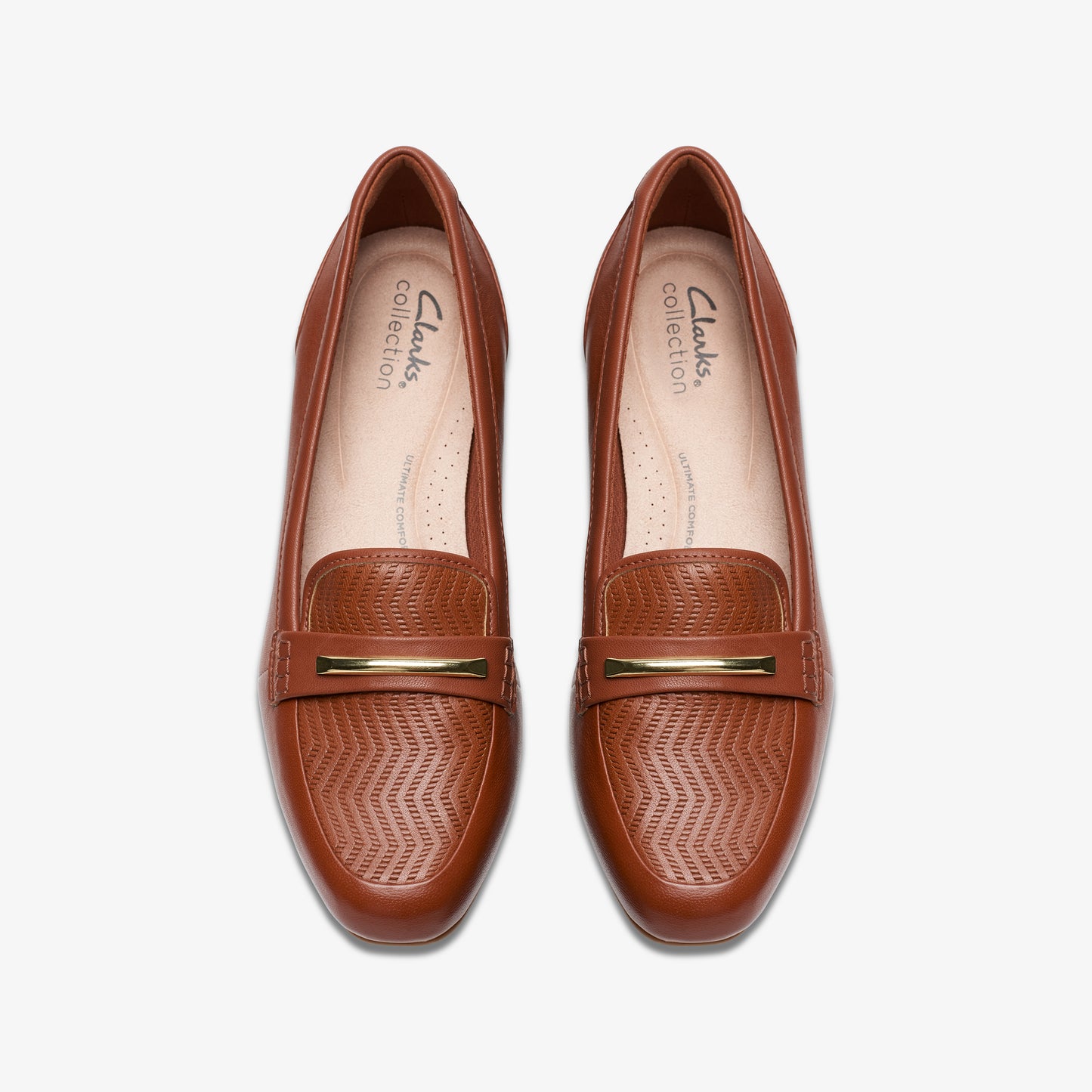 Pair of brown leather loafers with gold-colored hardware.