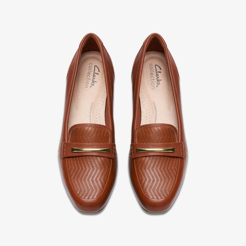 Pair of brown leather loafers with gold-colored hardware.
