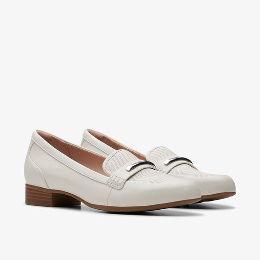 Pair of white leather loafers with a silver-tone metal detail on the vamp.