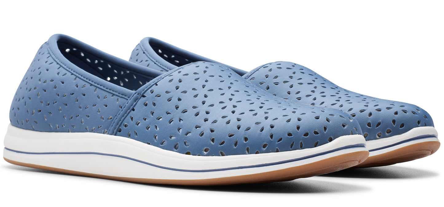 Pair of blue slip-on shoes with perforated design and white soles.