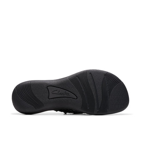 Black sandal sole with curved and branded texture.