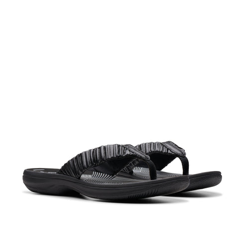 Black flip-flops with gathered strap.