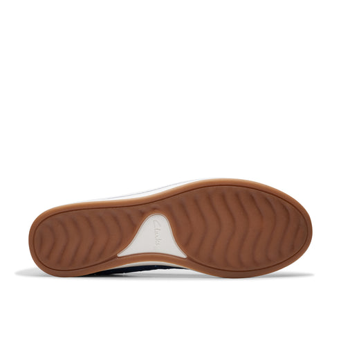 Shoe sole with a brown color and waved pattern.