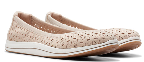 A pair of beige ballerina shoes with cutout pattern on the upper and white sole.
