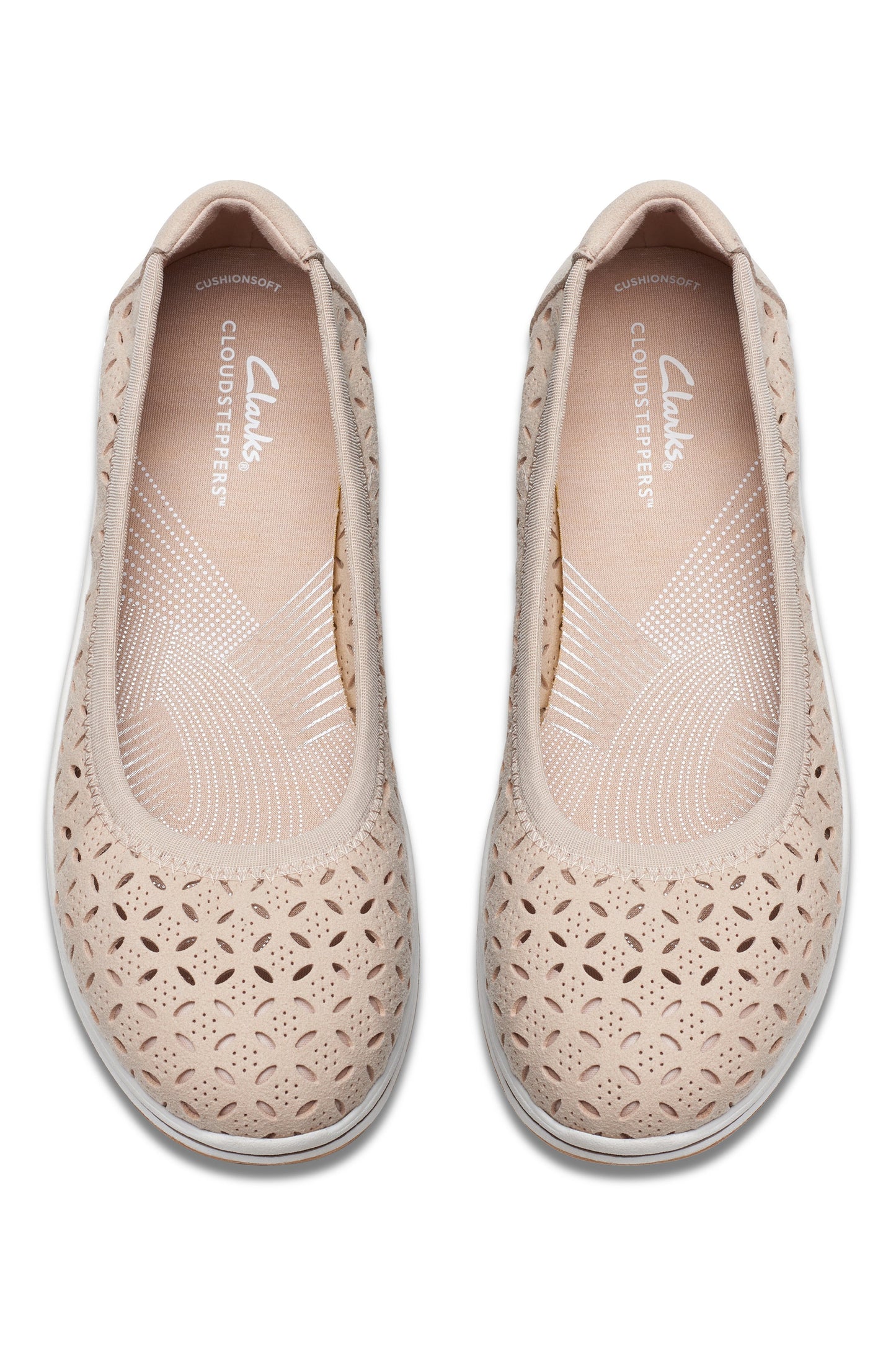 Pair of beige flats with patterned perforations.